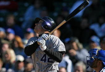 CHICAGO - APRIL 15: Jeff Baker of the Colorado Rockies, wearing a #42 jersey on Jackie Robinson Day, hits the ball against the Chicago Cubs on April 15, 2009 at Wrigley Field in Chicago, Illinois. The Rockies defeated the Cubs 5-2. (Photo by Jonathan Daniel/Getty Images) 