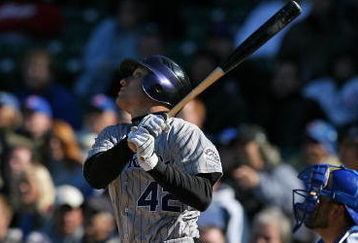 CHICAGO - APRIL 15: Jeff Baker of the Colorado Rockies, wearing a #42 jersey on Jackie Robinson Day, hits the ball against the Chicago Cubs on April 15, 2009 at Wrigley Field in Chicago, Illinois. The Rockies defeated the Cubs 5-2. (Photo by Jonathan Daniel/Getty Images) 