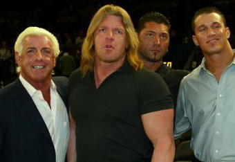 NEW YORK - MARCH 9:  WWE wrestlers (L-R) Ric Flair, Triple H, Batista, Randy Orton, Stacy Kiebler & Miss Jackie attend the New York Knicks v Boston Celtics  NBA game March 9, 2004 at Madison Square Garden in New York City.   (Photo by Ray Amati/Getty Images)
