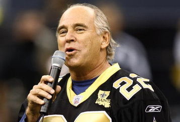 NEW ORLEANS - DECEMBER 03:  Jimmy Buffett sings the national anthem before the start of the game between the New Orleans Saints and San Francisco 49ers December 3, 2006 at the Superdome in New Orleans, Louisiana.  (Photo by Chris Graythen/Getty Images)