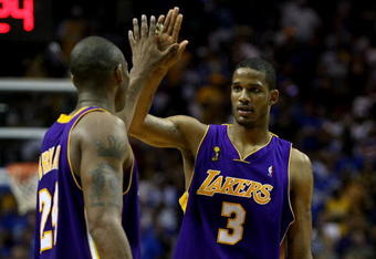 ORLANDO, FL - JUNE 14:  Kobe Bryant #24 and Trevor Ariza #3 of the Los Angeles Lakers high five in the final moments of the Lakers' win over the Orlando Magic in Game Five of the 2009 NBA Finals on June 14, 2009 at Amway Arena in Orlando, Florida.  NOTE TO USER:  User expressly acknowledges and agrees that, by downloading and or using this photograph, User is consenting to the terms and conditions of the Getty Images License Agreement.  (Photo by Elsa/Getty Images)