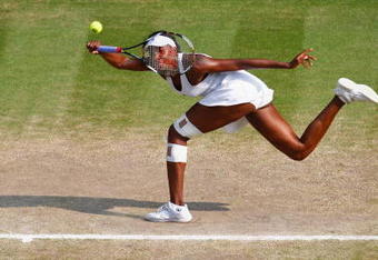 WIMBLEDON, ENGLAND - JULY 02:  Venus Williams of USA plays a forehand during the women's singles semi final match against Dinara Safina of Russia on Day Ten of the Wimbledon Lawn Tennis Championships at the All England Lawn Tennis and Croquet Club on July 2, 2009 in London, England.  (Photo by Sean Dempsey/Pool/Getty Images)
