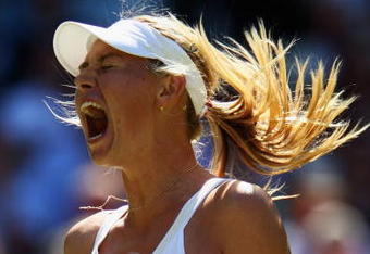 WIMBLEDON, ENGLAND - JUNE 24:  Maria Sharapova of Russia reacts during the women's singles second round match against Gisela Dulko of Argentina on Day Three of the Wimbledon Lawn Tennis Championships at the All England Lawn Tennis and Croquet Club on June 24, 2009 in London, England.  (Photo by Clive Brunskill/Getty Images)