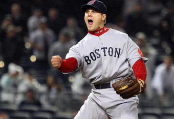 NEW YORK - MAY 04:  Jonathan Papelbon #58 of the Boston Red Sox reacts after getting the final out of the game with the bases loaded against the New York Yankees on May 4, 2009 at Yankee Stadium in the Bronx borough of New York City. The Red Sox defeated the Yankees 6-4.  (Photo by Jim McIsaac/Getty Images)