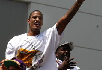 LOS ANGELES, CA - JUNE 17:  Trevor Ariza #3  waves to the crowd from the top of a double decker bus at the start of Los Angeles Lakers NBA championship victory parade outside the Staples Center on June 17, 2009 in Los Angeles, California.  (Photo by Stephen Dunn/Getty Images)