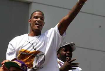 LOS ANGELES, CA - JUNE 17:  Trevor Ariza #3  waves to the crowd from the top of a double decker bus at the start of Los Angeles Lakers NBA championship victory parade outside the Staples Center on June 17, 2009 in Los Angeles, California.  (Photo by Stephen Dunn/Getty Images)