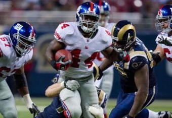 ST. LOUIS, MO - SEPTEMBER 14:  Ahmad Bradshaw #44 of the New York Giants rushes against the St. Louis Rams at the Edward Jones Dome on September 14, 2008 in St. Louis, Missouri.  The Giants beat the Rams 41-13.   (Photo by Dilip Vishwanat/Getty Images)