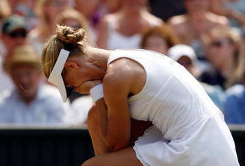 WIMBLEDON, ENGLAND - JULY 02:  Elena Dementieva of Russia reacts during the women's singles semi final match against Serena Williams of USA on Day Ten of the Wimbledon Lawn Tennis Championships at the All England Lawn Tennis and Croquet Club on July 2, 2009 in London, England.  (Photo by Paul Gilham/Getty Images)