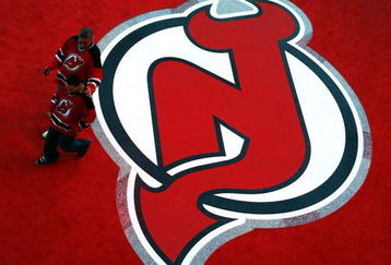 NEWARK, NJ - OCTOBER 27:  The first fans through the door walk across a logo on the atrium floor before a game between the Ottawa Senators and the New Jersey Devils at the newly opened Prudential Center October 27, 2007 in Newark, New Jersey. (Photo by Jeff Zelevansky/Getty Images)