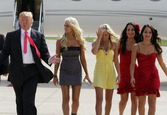 GREEN BAY, WI - JUNE 22:  Donald Trump (C) and the WWE DIVA girls attend a press conference about the WWE at the Austin Straubel International Airport on June 22, 2009 in Green Bay, Wisconsin.  (Photo by Mark A. Wallenfang/Getty Images)