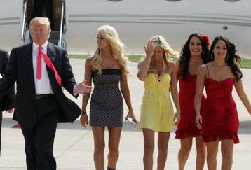 GREEN BAY, WI - JUNE 22:  Donald Trump (C) and the WWE DIVA girls attend a press conference about the WWE at the Austin Straubel International Airport on June 22, 2009 in Green Bay, Wisconsin.  (Photo by Mark A. Wallenfang/Getty Images)