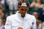 WIMBLEDON, ENGLAND - JUNE 26:  Roger Federer of Switzerland prepares prior to the men's singles third round match against Philipp Kohlschreiber of Germany on Day Five of the Wimbledon Lawn Tennis Championships at the All England Lawn Tennis and Croquet Club on June 26, 2009 in London, England.  (Photo by Paul Gilham/Getty Images)