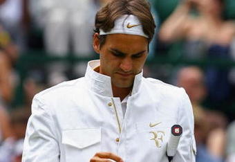 WIMBLEDON, ENGLAND - JUNE 26:  Roger Federer of Switzerland prepares prior to the men's singles third round match against Philipp Kohlschreiber of Germany on Day Five of the Wimbledon Lawn Tennis Championships at the All England Lawn Tennis and Croquet Club on June 26, 2009 in London, England.  (Photo by Paul Gilham/Getty Images)