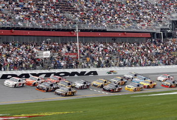 DAYTONA BEACH, FL - FEBRUARY 15:  David Ragan, driver of the #6 UPS Ford races Denny Hamlin, driver of the #11 FedEx Express Toyota, and Joey Logano, driver of the #20 Home Depot Toyota, during the NASCAR Sprint Cup Series Daytona 500 at Daytona International Speedway on February 15, 2009 in Daytona Beach, Florida.  (Photo by Geoff Burke/Getty Images for NASCAR)