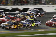 DAYTONA BEACH, FL - FEBRUARY 15:  Clint Bowyer, driver of the #33 Cheerios/Hamburger Helper Chevrolet, leads a pack of cars through the tri-oval during the NASCAR Sprint Cup Series Daytona 500 at Daytona International Speedway on February 15, 2009 in Daytona Beach, Florida.  (Photo by Geoff Burke/Getty Images for NASCAR)