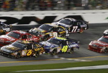DAYTONA BEACH, FL - FEBRUARY 15:  Clint Bowyer, driver of the #33 Cheerios/Hamburger Helper Chevrolet, leads a pack of cars through the tri-oval during the NASCAR Sprint Cup Series Daytona 500 at Daytona International Speedway on February 15, 2009 in Daytona Beach, Florida.  (Photo by Geoff Burke/Getty Images for NASCAR)