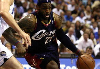 ORLANDO, FL - MAY 30:  LeBron James #23 of the Cleveland Cavaliers drives to the hoop against Hedo Turkoglu #15 of the Orlando Magic in Game Six of the Eastern Conference Finals during the 2009 Playoffs at Amway Arena on May 30, 2009 in Orlando, Florida. NOTE TO USER: User expressly acknowledges and agrees that, by downloading and or using this photograph, User is consenting to the terms and conditions of the Getty Images License Agreement  (Photo by Elsa/Getty Images)
