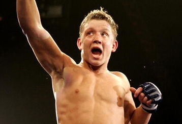 HOUSTON, TX - FEBRUARY 02:  Chris Horodecki Lightweight fighter for the Anacondas celebrates after defeating Bart Palaszewski of the Silverbacks during the International Fight League event at the Reliant Arena on February 2, 2007 in Houston, Texas.  (Photo by Robert Laberge/Getty Images for IFL)