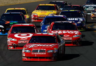 SONOMA, CA - JUNE 21:  Kasey Kahne, driver of the #9 Budweiser Dodge, leads the field during the NASCAR Sprint Cup Series Toyota/Save Mart 350 at the Infineon Raceway on June 21, 2009 in Sonoma, California.  (Photo by Jonathan Ferrey/Getty Images)
