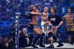HOUSTON, TX - APRIL 5:  (L-R) Former professional wrestlers Ric Flair (seen outside the ring) looks on as WWE Superstar Chris Jericho gets pummeled on the ropes by 'Rowdy' Roddy Piper. Ricky 'The Dragon' Steamboat and Jimmy 'Superfly' Snuka look on during  WrestleMania 25 at Reliant Stadium on April 5, 2009 in Houston, Texas.  (Photo by Bill Olive/Getty Images)