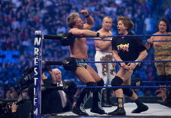 HOUSTON, TX - APRIL 5:  (L-R) Former professional wrestlers Ric Flair (seen outside the ring) looks on as WWE Superstar Chris Jericho gets pummeled on the ropes by 'Rowdy' Roddy Piper. Ricky 'The Dragon' Steamboat and Jimmy 'Superfly' Snuka look on during  WrestleMania 25 at Reliant Stadium on April 5, 2009 in Houston, Texas.  (Photo by Bill Olive/Getty Images)