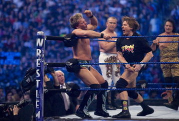 HOUSTON, TX - APRIL 5:  (L-R) Former professional wrestlers Ric Flair (seen outside the ring) looks on as WWE Superstar Chris Jericho gets pummeled on the ropes by 'Rowdy' Roddy Piper. Ricky 'The Dragon' Steamboat and Jimmy 'Superfly' Snuka look on during  WrestleMania 25 at Reliant Stadium on April 5, 2009 in Houston, Texas.  (Photo by Bill Olive/Getty Images)