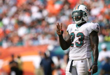 MIAMI - OCTOBER 05:  Running back Ronnie Brown #23 of the Miami Dolphins gestures to the sidelines while taking on the San Diego Chargers at Dolphin Stadium on October 5, 2008 in Miami, Florida. The Dolphins defeated the Chargers 17-10.  (Photo by Doug Benc/Getty Images)