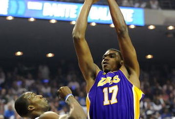 ORLANDO, FL - JUNE 14:  Andrew Bynum #17 of the Los Angeles Lakers shoots over Dwight Howard #12 of the Orlando Magic in the first quarter of Game Five of the 2009 NBA Finals on June 14, 2009 at Amway Arena in Orlando, Florida.  NOTE TO USER:  User expressly acknowledges and agrees that, by downloading and or using this photograph, User is consenting to the terms and conditions of the Getty Images License Agreement.  (Photo by Ronald Martinez/Getty Images)