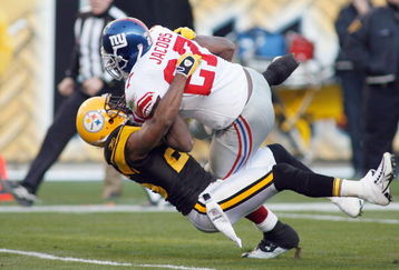 PITTSBURGH - OCTOBER 26:  Brandon Jacobs #27 of the New York Giants is tackled by Deshea Townsend #26 of the Pittsburgh Steelers at Heinz Field on October 26, 2008 in Pittsburgh, Pennsylvania. (Photo by: Rick Stewart/Getty Images)