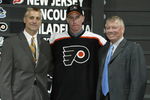 NASHVILLE, TN - JUNE 21:  (L to R) Paul Holmgren, first round draft pick (#11 overall), Jeff Carter, Bob Clarke of the Philadelphia Flyers pose for a portrait on stage during the 2003 NHL Entry Draft at the Gaylord Entertainment Center on June 21, 2003 in Nashville, Tennessee. (Photo by Elsa/Getty Images/NHLI)