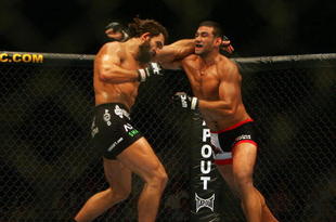 MANCHESTER, UNITED KINGDOM - APRIL 21: Andrei Arlovski of USA and Fabricio Werdum of Brazil in action during a Heavyweight bout of the Ultimate Fighting Championship at the Manchester Evening News Arena on April 21, 2007 in Manchester, England (Photo by Gary M. Prior/Getty Images).