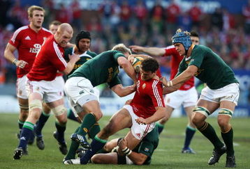 PRETORIA, SOUTH AFRICA - JUNE 27:  South Africa defence stop Jamie Roberts of the Lions from breaking through during the Second Test match between South Africa and the British and Irish Lions at Loftus Versfeld on June 27, 2009 in Pretoria, South Africa.  (Photo by David Rogers/Getty Images)