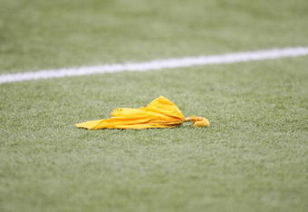 MINNEAPOLIS - SEPTEMBER 21:  A penalty flag lays on the field during the NFL game between the Minnesota Vikings and the Carolina Panthers at the Hubert H. Humphrey Metrodome on September 21, 2008 in Minneapolis, Minnesota. The Vikings defeated the Panthers 20-10. (Photo by David Sherman/Getty Images)