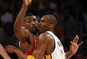 LOS ANGELES, CA - MAY 17:  Kobe Bryant #24 of the Los Angeles Lakers is covered by Ron Artest #96 of the Houston Rockets in the third quarter of Game Seven of the Western Conference Semifinals during the 2009 NBA Playoffs at Staples Center on May 17, 2009 in Los Angeles, California. NOTE TO USER: User expressly acknowledges and agrees that, by downloading and or using this photograph, User is consenting to the terms and conditions of the Getty Images License Agreement.  (Photo by Stephen Dunn/Getty Images)