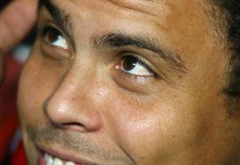 LISBON, PORTUGAL - NOVEMBER 28:  Ronaldo of AC Milan looks on from the substitutes bench before the kick off of the UEFA Champions League Group D match between Benfica and AC Milan at the Luz Stadium on November 28, 2007 in Lisbon, Portugal.  (Photo by Paul Gilham/Getty Images)