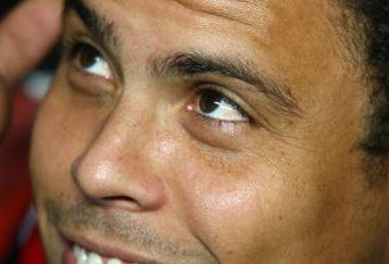 LISBON, PORTUGAL - NOVEMBER 28:  Ronaldo of AC Milan looks on from the substitutes bench before the kick off of the UEFA Champions League Group D match between Benfica and AC Milan at the Luz Stadium on November 28, 2007 in Lisbon, Portugal.  (Photo by Paul Gilham/Getty Images)