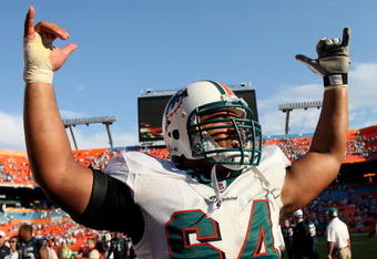 MIAMI - NOVEMBER 09:  Offensive lineman Samson Satele #64 of the Miami Dolphins celebrates his team's victory over the Seattle Seahawks at Dolphin Stadium on November 9, 2008 in Miami, Florida. The Dolphins defeated the Seahawks 21-19.  (Photo by Doug Benc/Getty Images)