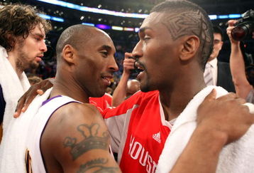 LOS ANGELES, CA - MAY 17:  Kobe Bryant #24 of the Los Angeles Lakers hugs Ron Artest #96 of the Houston Rockets after the Lakers defeated the Rockets 89-70 in Game Seven of the Western Conference Semifinals during the 2009 NBA Playoffs at Staples Center on May 17, 2009 in Los Angeles, California. NOTE TO USER: User expressly acknowledges and agrees that, by downloading and or using this photograph, User is consenting to the terms and conditions of the Getty Images License Agreement.  (Photo by Stephen Dunn/Getty Images)