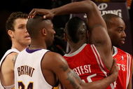 LOS ANGELES, CA - MAY 17:  Kobe Bryant #24 of the Los Angeles Lakers and Ron Artest #96 of the Houston Rockets get twisted up in the second quarter of Game Seven of the Western Conference Semifinals during the 2009 NBA Playoffs at Staples Center on May 17, 2009 in Los Angeles, California. NOTE TO USER: User expressly acknowledges and agrees that, by downloading and or using this photograph, User is consenting to the terms and conditions of the Getty Images License Agreement.  (Photo by Stephen Dunn/Getty Images)