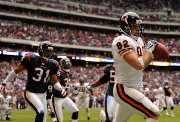 HOUSTON - DECEMBER 28:  Greg Olsen #82 of the Chicago Bears makes a catch for a touchdown in front of Brandon Harrison #31 of the Houston Texans during the second half at the Reliant Stadium on December 28, 2008 in Houston, Texas. The Texans won 31-24.  (Photo by Harry How/Getty Images)