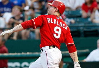 ARLINGTON, TX - JULY 1:  Designated hitter Hank Blalock #9 of the Texas Rangers watches his solo homerun against the Los Angeles Angels of Anaheim in the fourth inning at Rangers Ballpark July 1, 2009 in Arlington, Texas.  (Photo by Ronald Martinez/Getty Images)