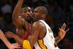 LOS ANGELES, CA - MAY 17:  Kobe Bryant #24 of the Los Angeles Lakers is covered by Ron Artest #96 of the Houston Rockets in the third quarter of Game Seven of the Western Conference Semifinals during the 2009 NBA Playoffs at Staples Center on May 17, 2009 in Los Angeles, California. NOTE TO USER: User expressly acknowledges and agrees that, by downloading and or using this photograph, User is consenting to the terms and conditions of the Getty Images License Agreement.  (Photo by Stephen Dunn/Getty Images)