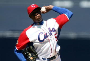 SAN DIEGO - MARCH 15: Aroldis Chapman #52 of team Cuba pitches against team Japan during the 2009 World Baseball Classic Round 2 Pool 1 match on March 15, 2009 at Petco Park in San Diego, California.  (Photo by Donald Miralle/Getty Images)