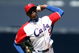 SAN DIEGO - MARCH 15: Aroldis Chapman #52 of team Cuba pitches against team Japan during the 2009 World Baseball Classic Round 2 Pool 1 match on March 15, 2009 at Petco Park in San Diego, California.  (Photo by Donald Miralle/Getty Images)