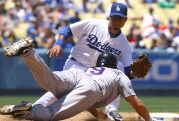 LOS ANGELES, CA - JULY 01:  Ryan Spilborghs #19 of the Colorado Rockies is caught stealing by shortstop Juan Castro #14 of the Los Angeles Dodgers during the fourth inning at Dodger Stadium on July 1, 2009 in Los Angeles, California.  The Dodgers defeated the Rockies 1-0.  (Photo by Jeff Gross/Getty Images)