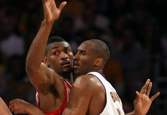 LOS ANGELES, CA - MAY 17:  Kobe Bryant #24 of the Los Angeles Lakers is covered by Ron Artest #96 of the Houston Rockets in the third quarter of Game Seven of the Western Conference Semifinals during the 2009 NBA Playoffs at Staples Center on May 17, 2009 in Los Angeles, California. NOTE TO USER: User expressly acknowledges and agrees that, by downloading and or using this photograph, User is consenting to the terms and conditions of the Getty Images License Agreement.  (Photo by Stephen Dunn/Getty Images)