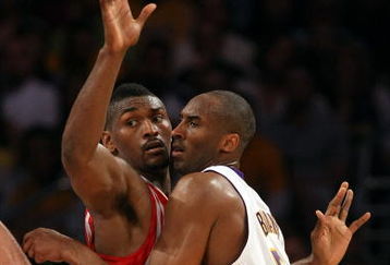 LOS ANGELES, CA - MAY 17:  Kobe Bryant #24 of the Los Angeles Lakers is covered by Ron Artest #96 of the Houston Rockets in the third quarter of Game Seven of the Western Conference Semifinals during the 2009 NBA Playoffs at Staples Center on May 17, 2009 in Los Angeles, California. NOTE TO USER: User expressly acknowledges and agrees that, by downloading and or using this photograph, User is consenting to the terms and conditions of the Getty Images License Agreement.  (Photo by Stephen Dunn/Getty Images)