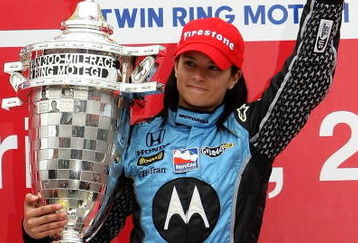 MOTEGI, JAPAN - APRIL 20:  Danica Patrick driver of the #7 Motorola Andretti Green Racing Honda Dallara poses with the trophy after winning the IndyCar Series Bridgestone Indy Japan 300 Mile on April 20, 2008 at Twin Ring Motegi in Motegi, Japan.  (Photo by Jonathan Ferrey/Getty Images)