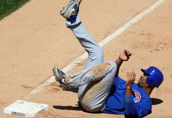CHICAGO - JUNE 28:  Derrek Lee #25 of the Chicago Cubs reacts after being forced out at third base with the bases loaded to end the Cubs half of the 6th inning against the Chicago White Sox on June 28, 2009 at U.S. Cellular Field in Chicago, Illinois. The White Sox defeated the Cubs 6-0. (Photo by Jonathan Daniel/Getty Images)