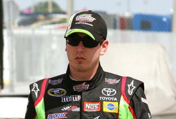 DAYTONA BEACH, FL - JULY 02:  Kyle Busch, driver of the #18  Interstate Batteries Toyota, walks through the garage area during practice for the NASCAR Sprint Cup Series Coke Zero 400 at Daytona International Speedway on July 2, 2009 in Daytona Beach, Florida.  (Photo by Jerry Markland/Getty Images for NASCAR)